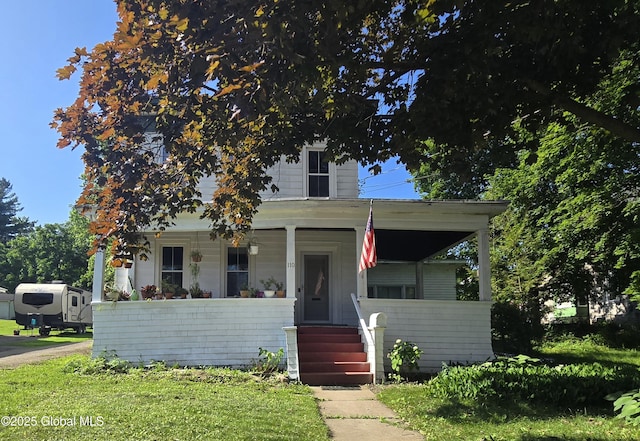110 Montgomery St, Canajoharie, NY 13317 - view of front of home with a porch