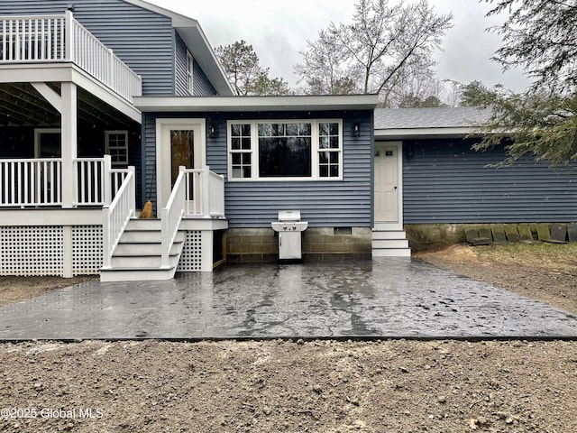 view of front of home with a patio area