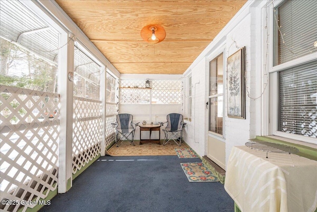 sunroom with wooden ceiling