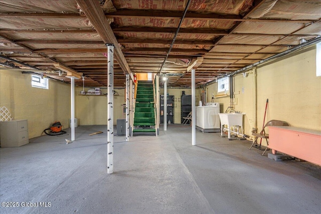 basement with stairway and a sink