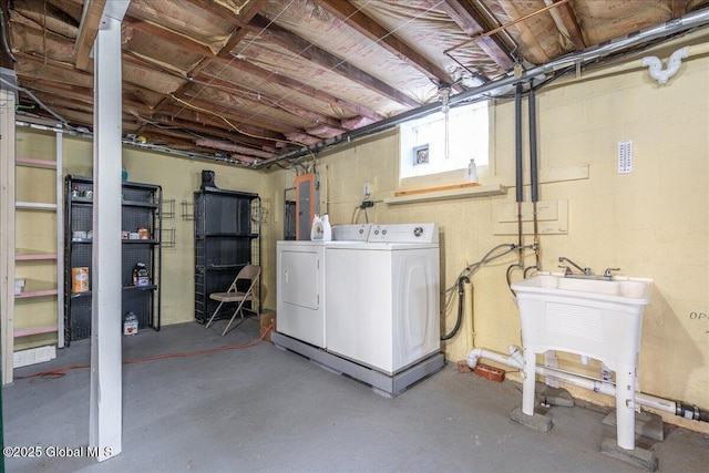 basement with washing machine and clothes dryer