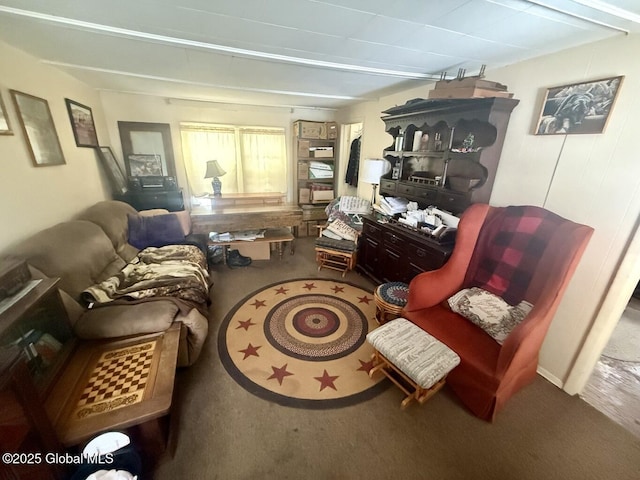 living area featuring carpet floors and beamed ceiling