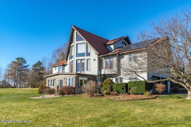 view of home's exterior with a yard