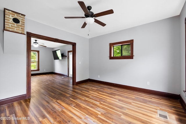 11208 State Route 22, Fort Ann, NY 12827 - unfurnished room with plenty of natural light, ceiling fan, and wood finished floors
