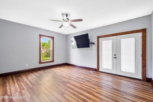 11208 State Route 22, Fort Ann, NY 12827 - empty room featuring french doors, ceiling fan, baseboards, and wood finished floors