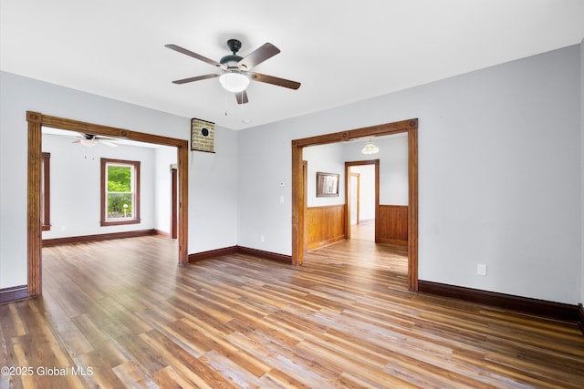11208 State Route 22, Fort Ann, NY 12827 - unfurnished room with ceiling fan, light wood-style floors, baseboards, and wainscoting