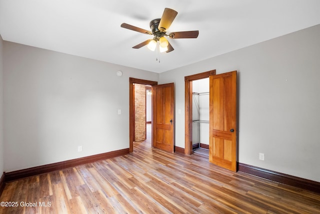 11208 State Route 22, Fort Ann, NY 12827 - unfurnished bedroom featuring baseboards, light wood-style flooring, a closet, and ceiling fan
