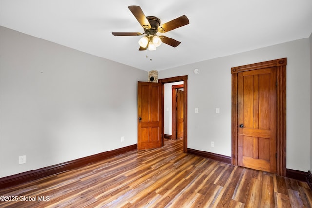 11208 State Route 22, Fort Ann, NY 12827 - unfurnished bedroom with baseboards, wood finished floors, and a ceiling fan