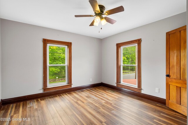 11208 State Route 22, Fort Ann, NY 12827 - spare room with baseboards, wood finished floors, and ceiling fan