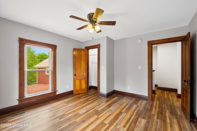 11208 State Route 22, Fort Ann, NY 12827 - unfurnished bedroom featuring wood finished floors, baseboards, and ceiling fan