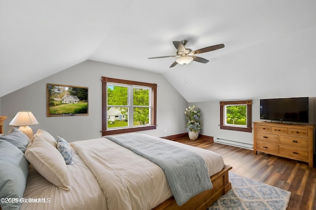 11208 State Route 22, Fort Ann, NY 12827 - bedroom featuring a baseboard heating unit, wood finished floors, vaulted ceiling, multiple windows, and a ceiling fan