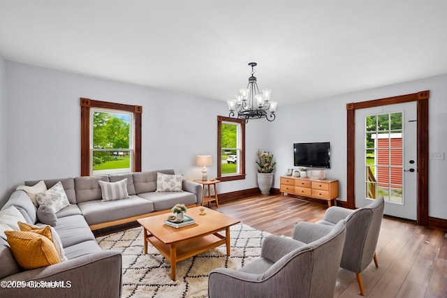 11208 State Route 22, Fort Ann, NY 12827 - living room with plenty of natural light, a chandelier, and light wood-style floors