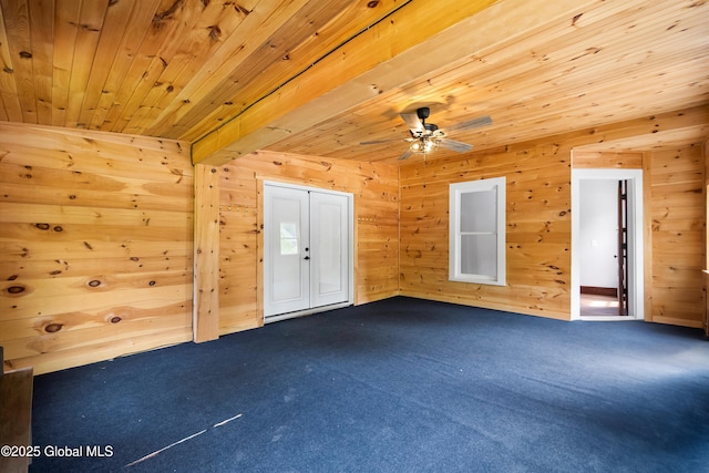11208 State Route 22, Fort Ann, NY 12827 - spare room with wooden ceiling, dark colored carpet, ceiling fan, and wooden walls