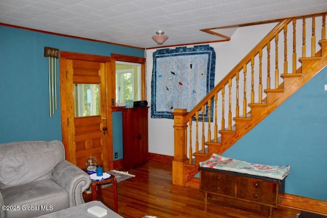 living room featuring crown molding and hardwood / wood-style floors