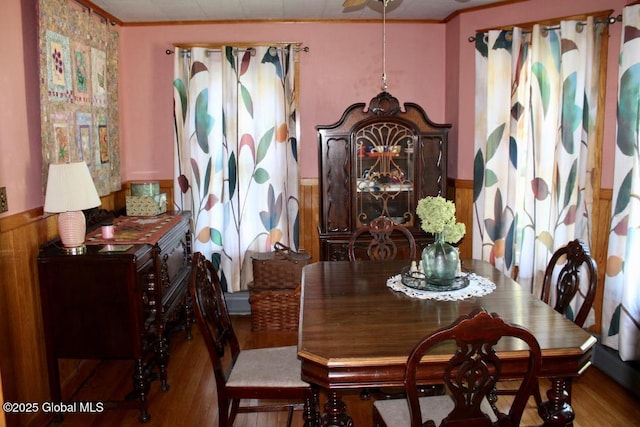 dining room featuring hardwood / wood-style flooring and crown molding