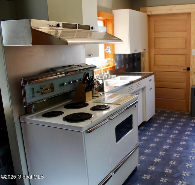 kitchen with sink, white cabinets, and white range with electric cooktop