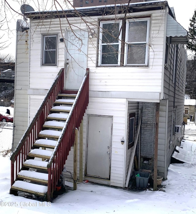 view of snow covered property entrance