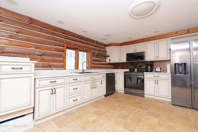 kitchen featuring appliances with stainless steel finishes, white cabinets, a sink, and log walls