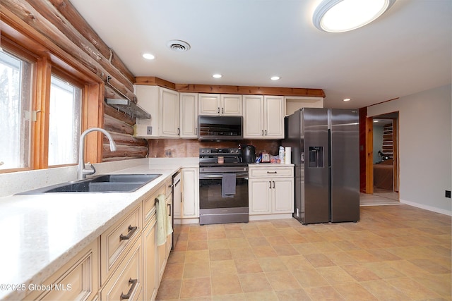 kitchen featuring visible vents, stainless steel appliances, a sink, and recessed lighting