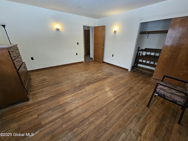 unfurnished bedroom featuring dark hardwood / wood-style floors