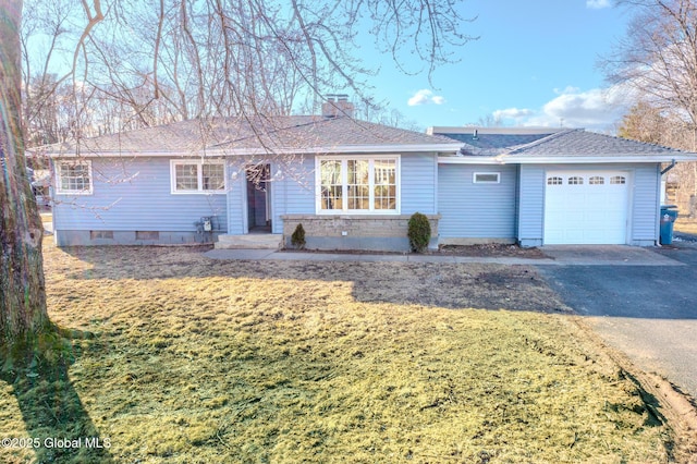 single story home with aphalt driveway, an attached garage, a shingled roof, and a chimney