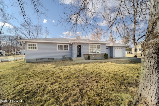 ranch-style house featuring a garage, driveway, and a front lawn