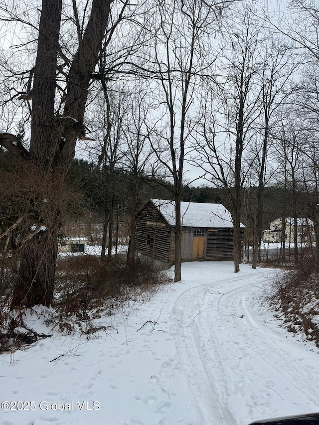 view of yard layered in snow