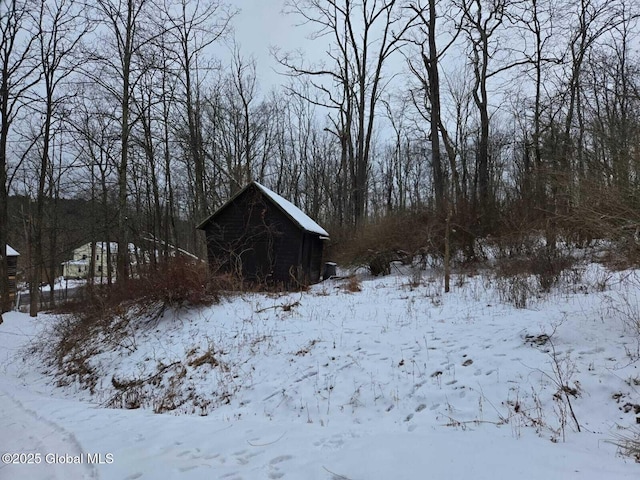 view of yard covered in snow