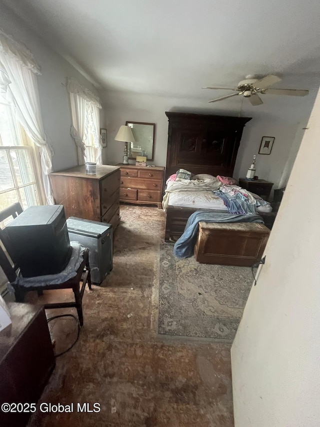 carpeted bedroom featuring ceiling fan