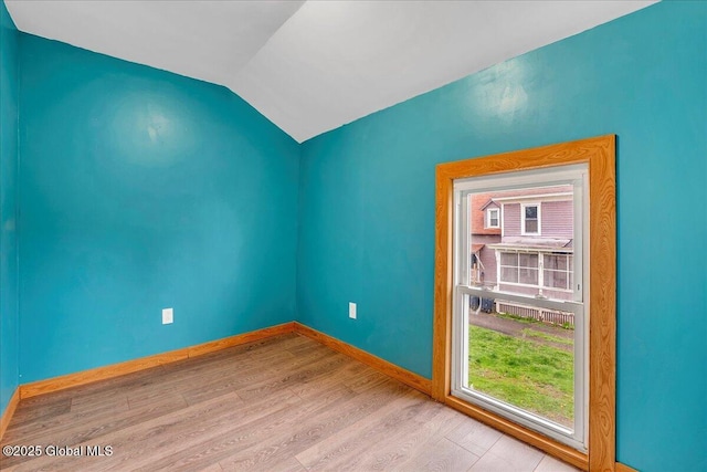7383 State Highway 28, Exeter, NY 13315 - unfurnished room featuring vaulted ceiling, wood finished floors, and baseboards