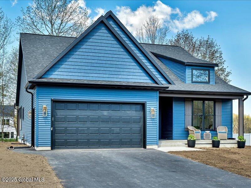 view of front of property featuring a garage and a porch