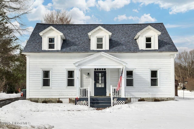 cape cod home with a shingled roof