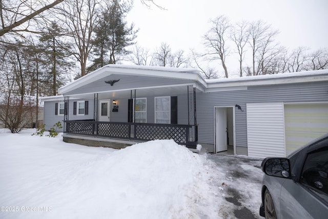 view of front of house with a garage and covered porch