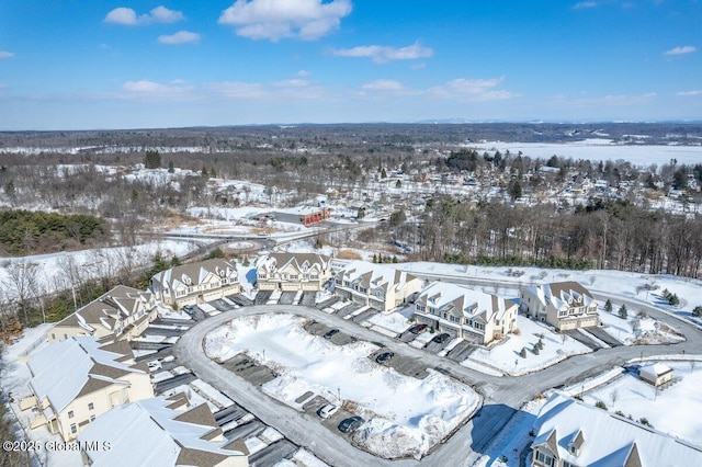 snowy aerial view featuring a residential view