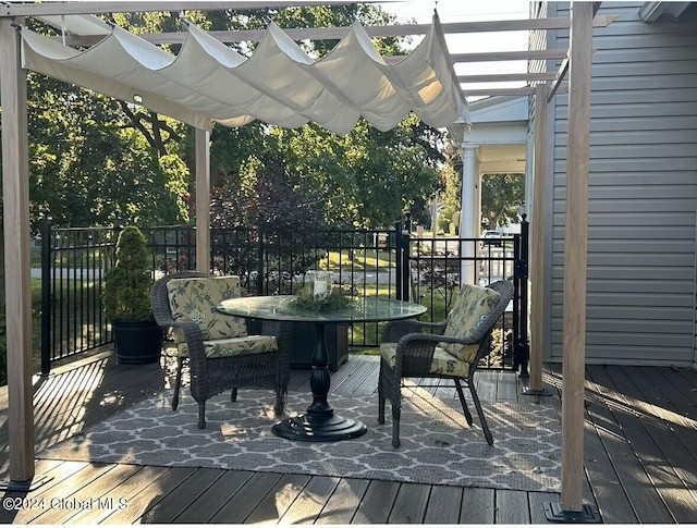 wooden deck featuring a pergola