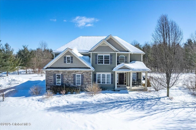 view of front of property featuring covered porch and stone siding