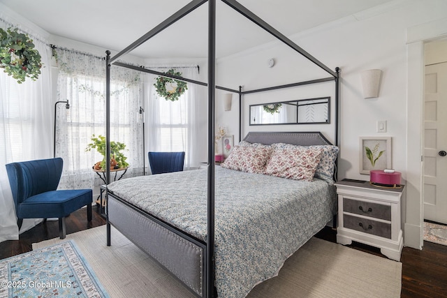 bedroom with wood finished floors