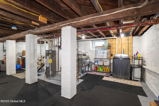 basement featuring washer / clothes dryer and water heater