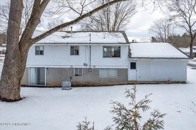 view of snow covered house