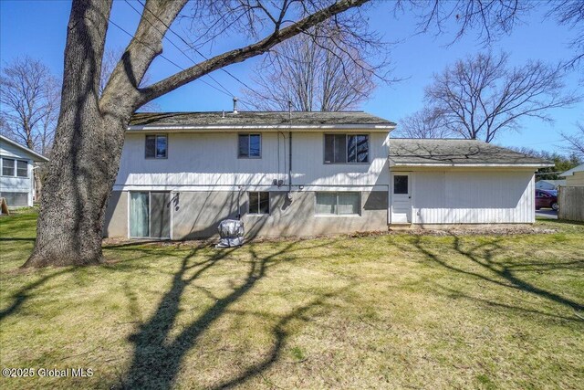 4 Iroquois Dr, Saratoga Springs, NY 12866 - back of house with a lawn