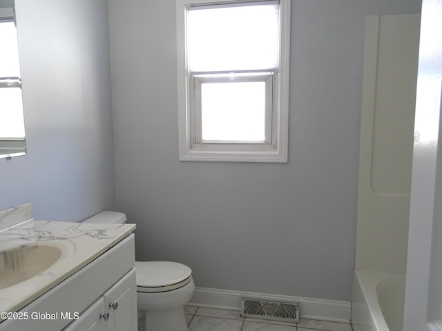 bathroom featuring baseboards, visible vents, vanity, and toilet