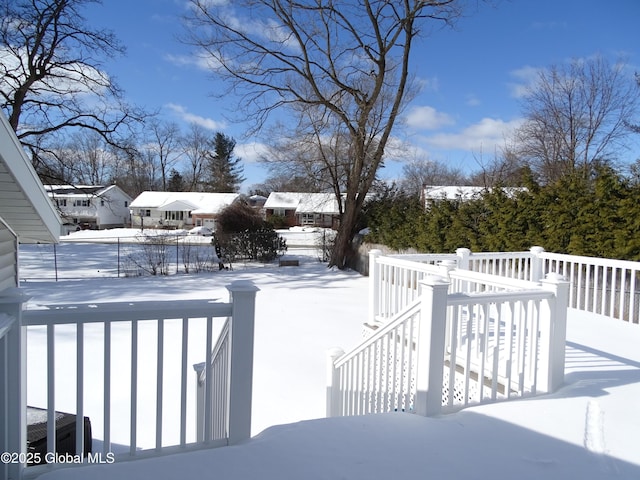 snow covered deck featuring central air condition unit