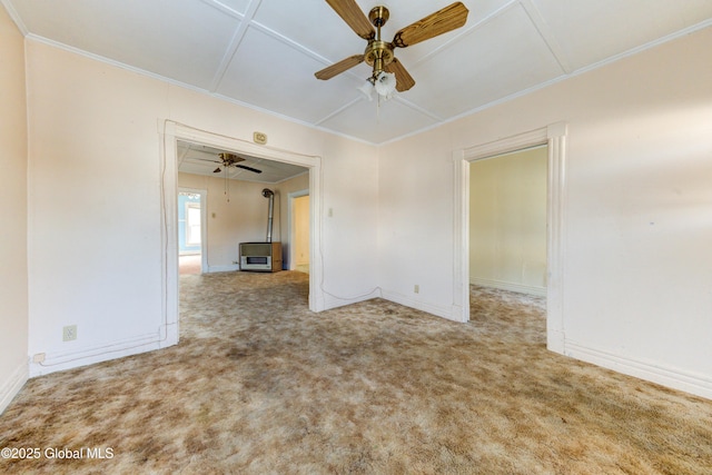 unfurnished room featuring carpet floors, ornamental molding, and ceiling fan