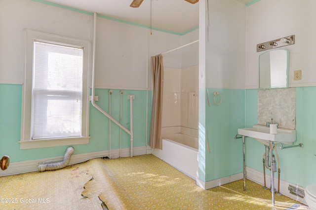 full bath featuring shower / bath combo and ceiling fan