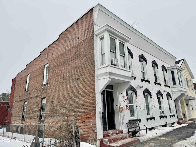 view of building exterior with cooling unit