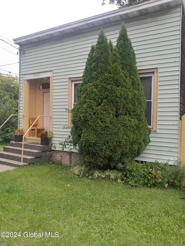 view of home's exterior featuring a yard