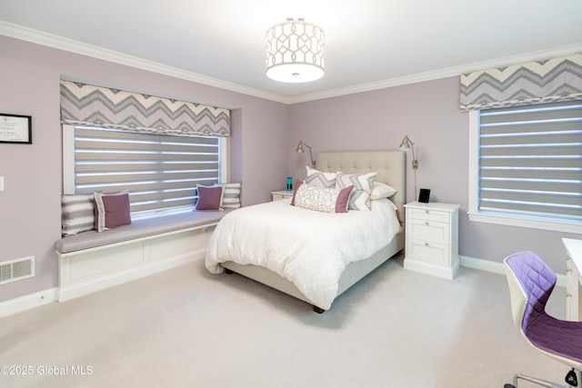 bedroom featuring baseboards, visible vents, crown molding, and light colored carpet