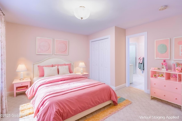 bedroom with a closet and baseboards