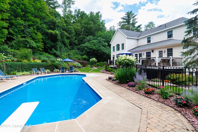 view of pool featuring a patio, fence, and a fenced in pool