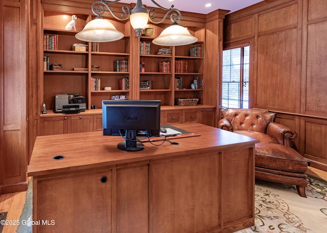 office area featuring wooden walls